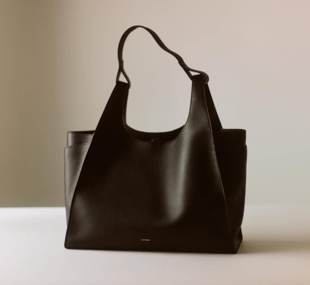 Large tote bag with short handles on light background