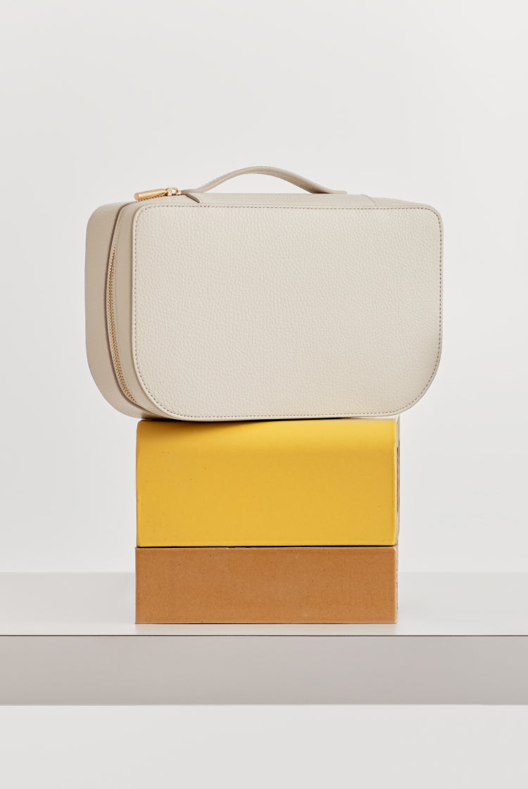 Handbag on top of two stacked boxes