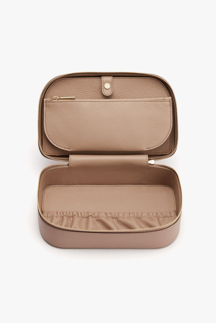 Open rectangular case with internal compartments and a zipper closure.