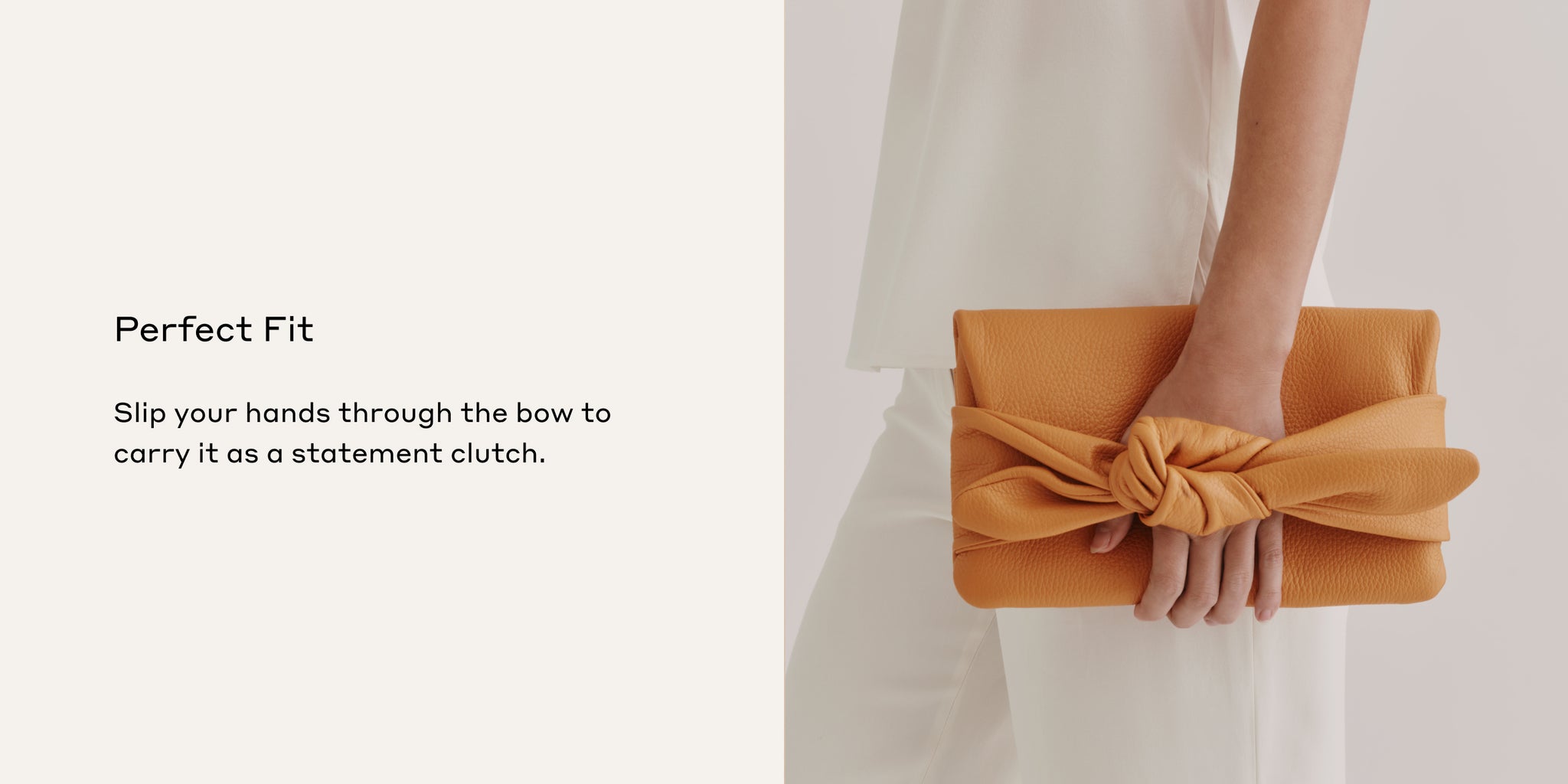 Person holding a large bow clutch bag with text about the product on the left side.