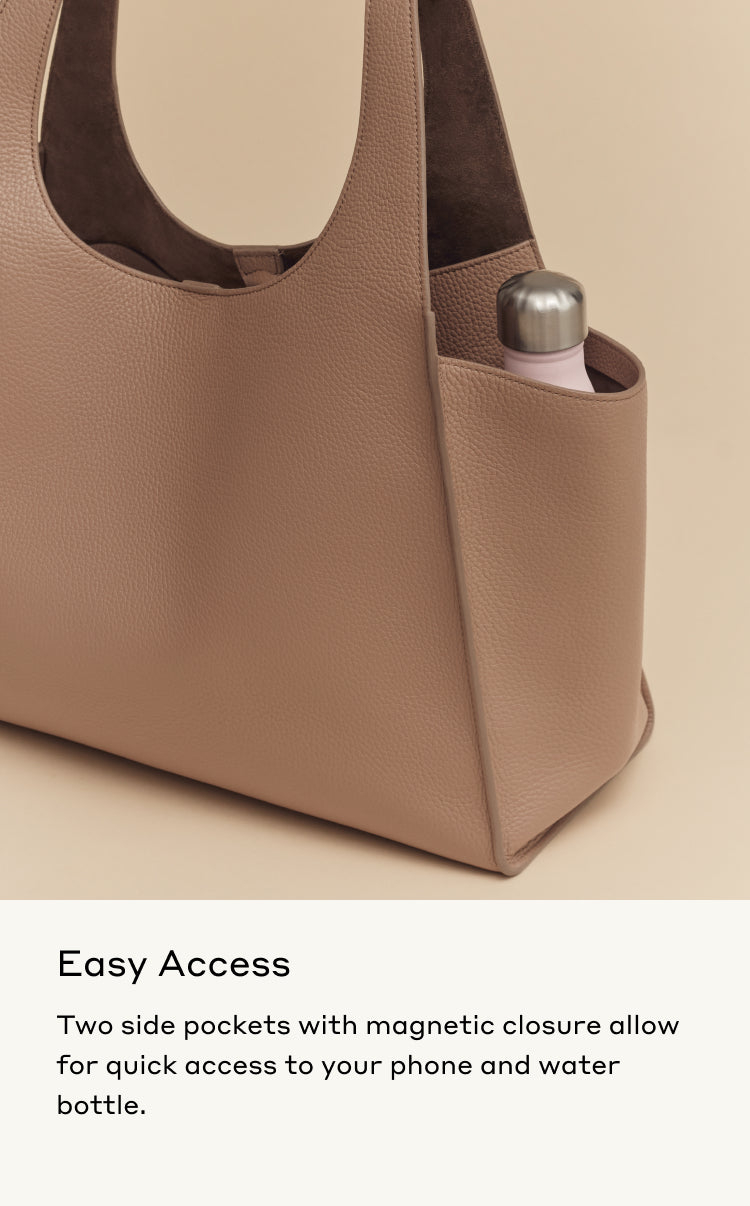 Handbag with external pockets containing a phone and a water bottle.
