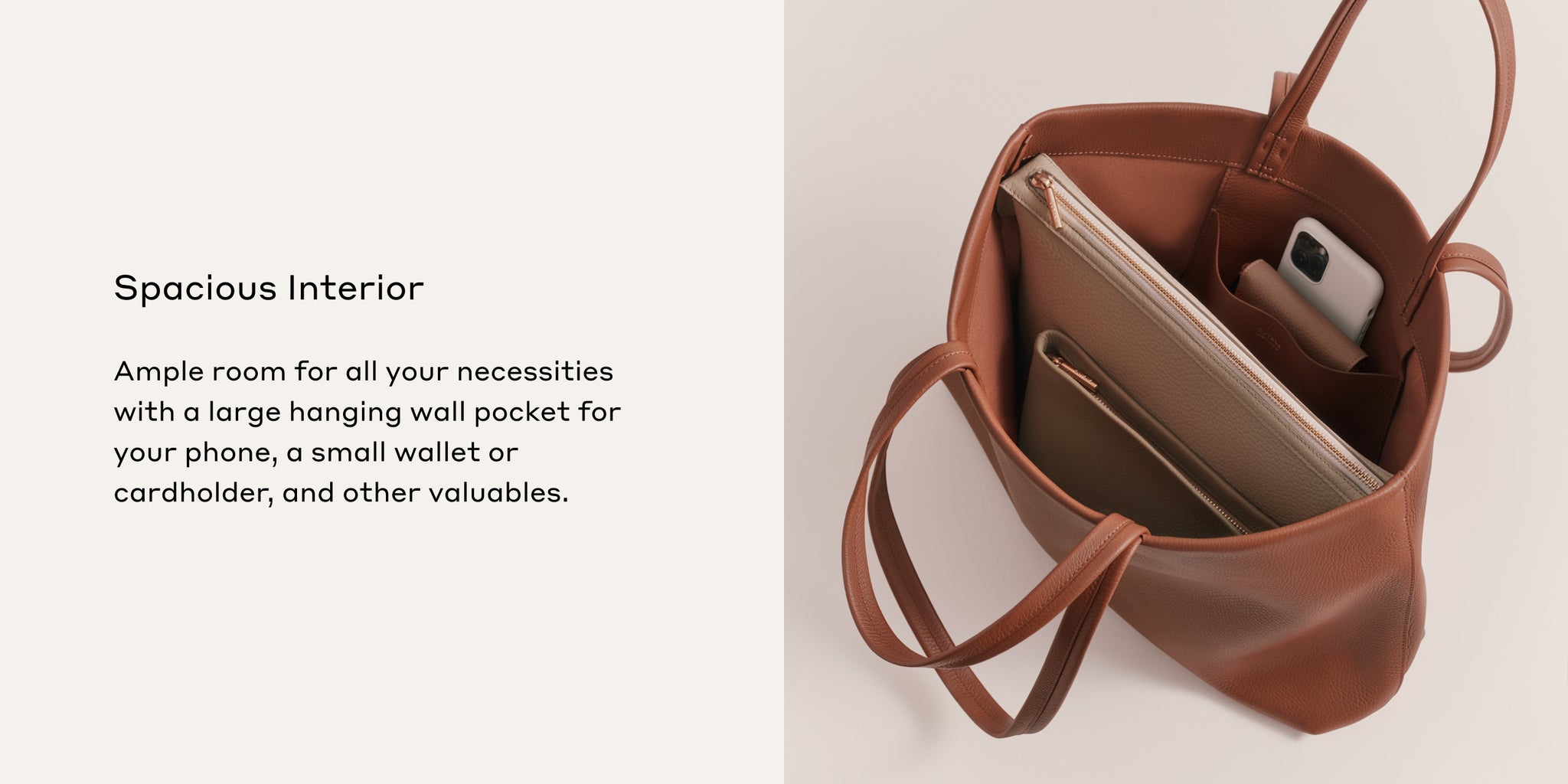 Open handbag with a smartphone and wallet inside.