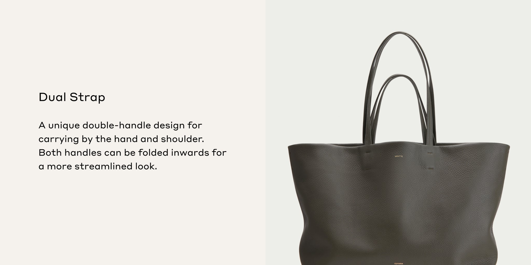 Handbag with two handles displayed upright against a plain background.