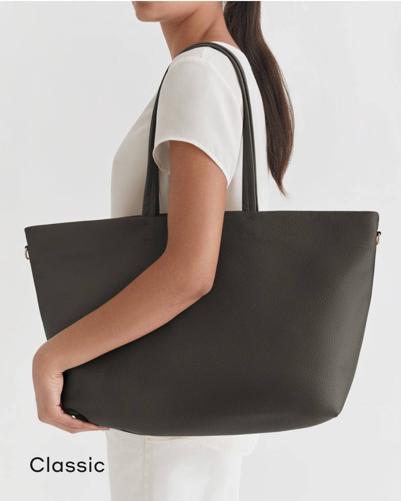 Woman holding a large tote bag over her shoulder