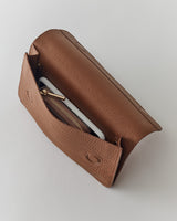 Open handbag with contents visible inside.