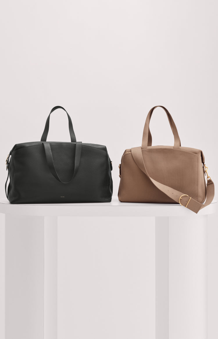 Two bags on a white shelf