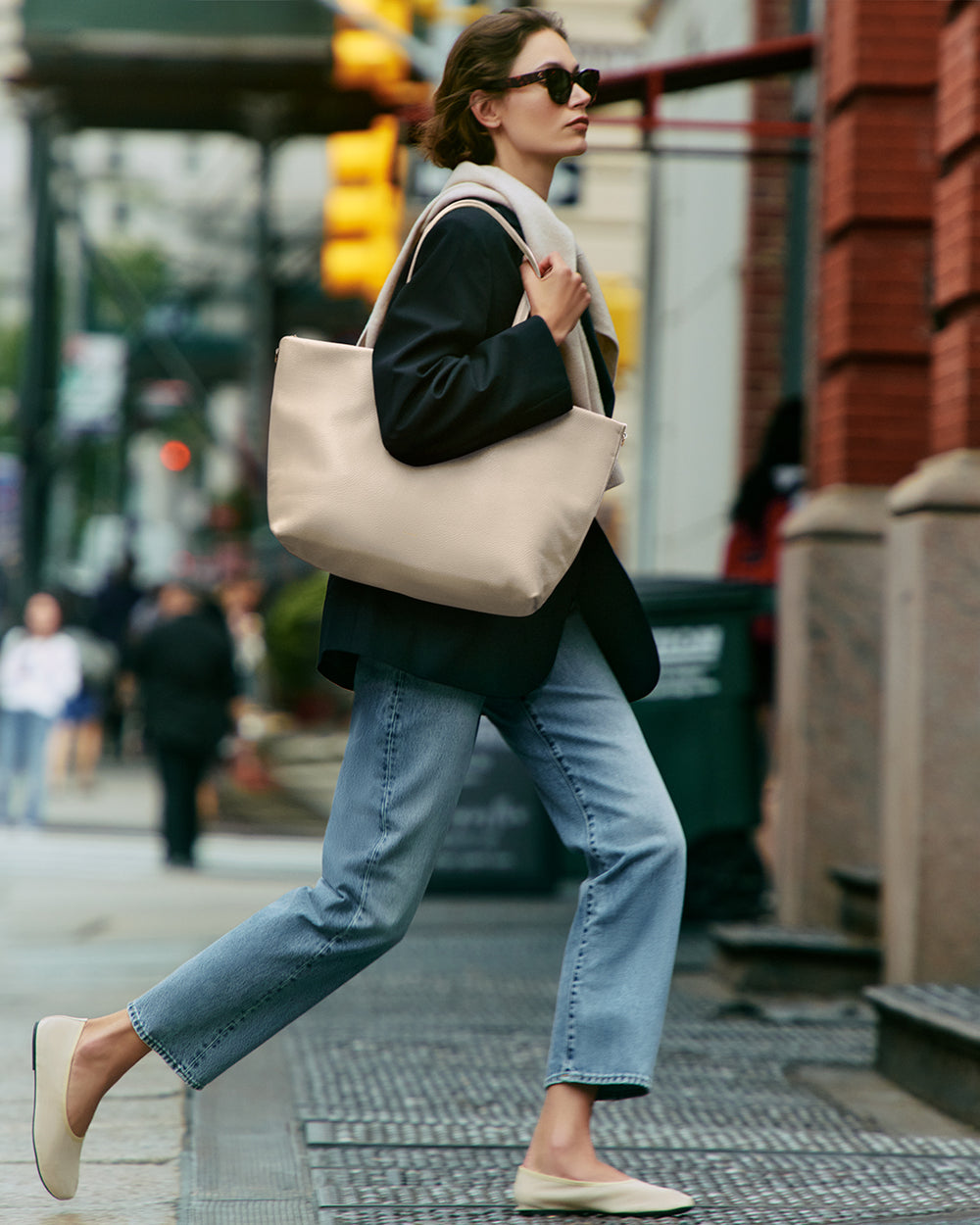 Classic Easy Zipper Tote Person walking on city street carrying large tote bag over shoulder