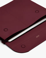 Open laptop case with two snaps and a visible laptop inside