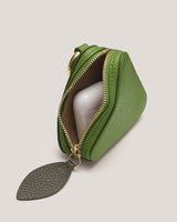 Small pouch with zippered closure containing wireless earbuds.