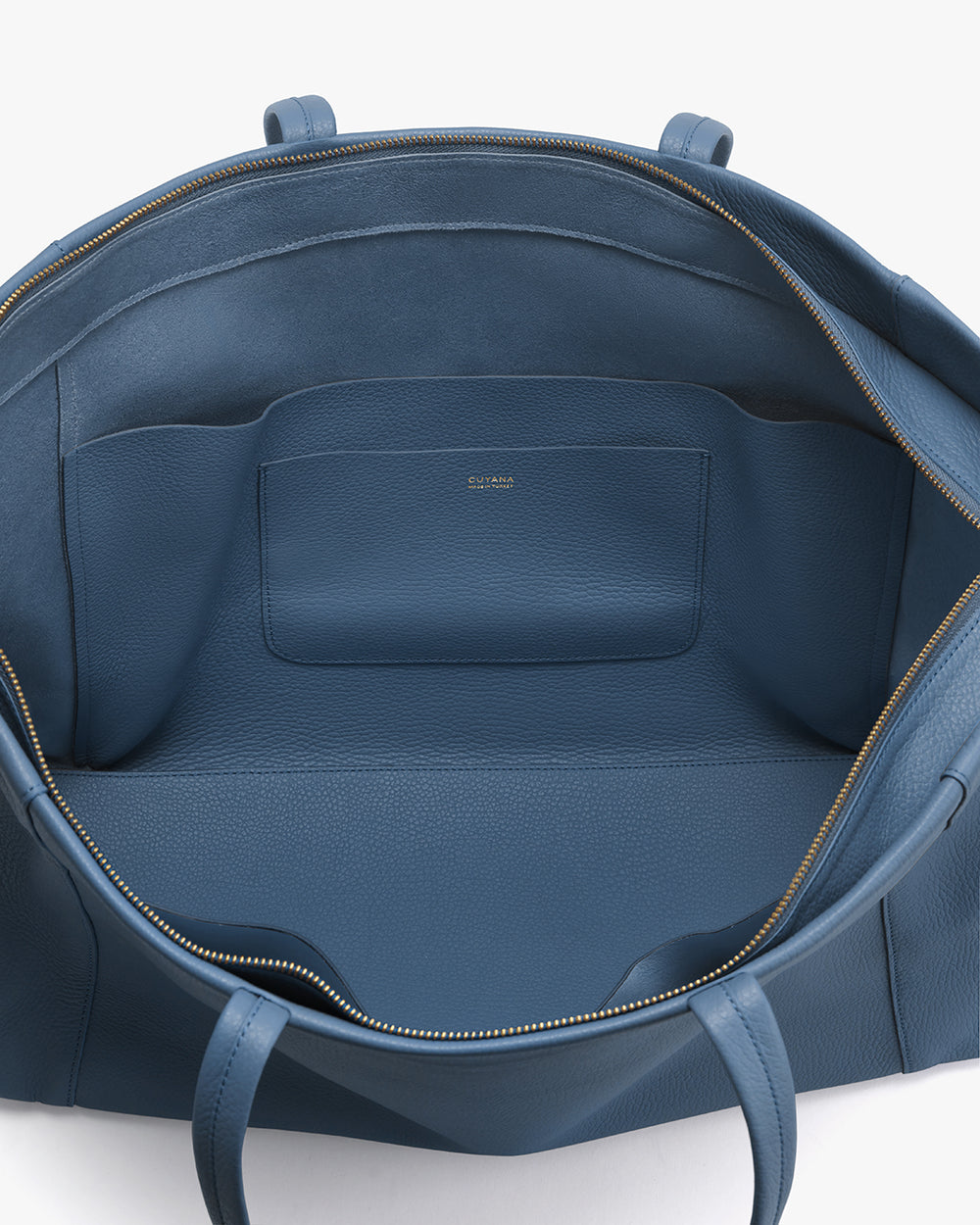 Easy Overnighter Bag Open tote bag with interior pockets and zipper.