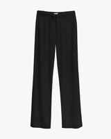 Loose-fitting pants on white backdrop