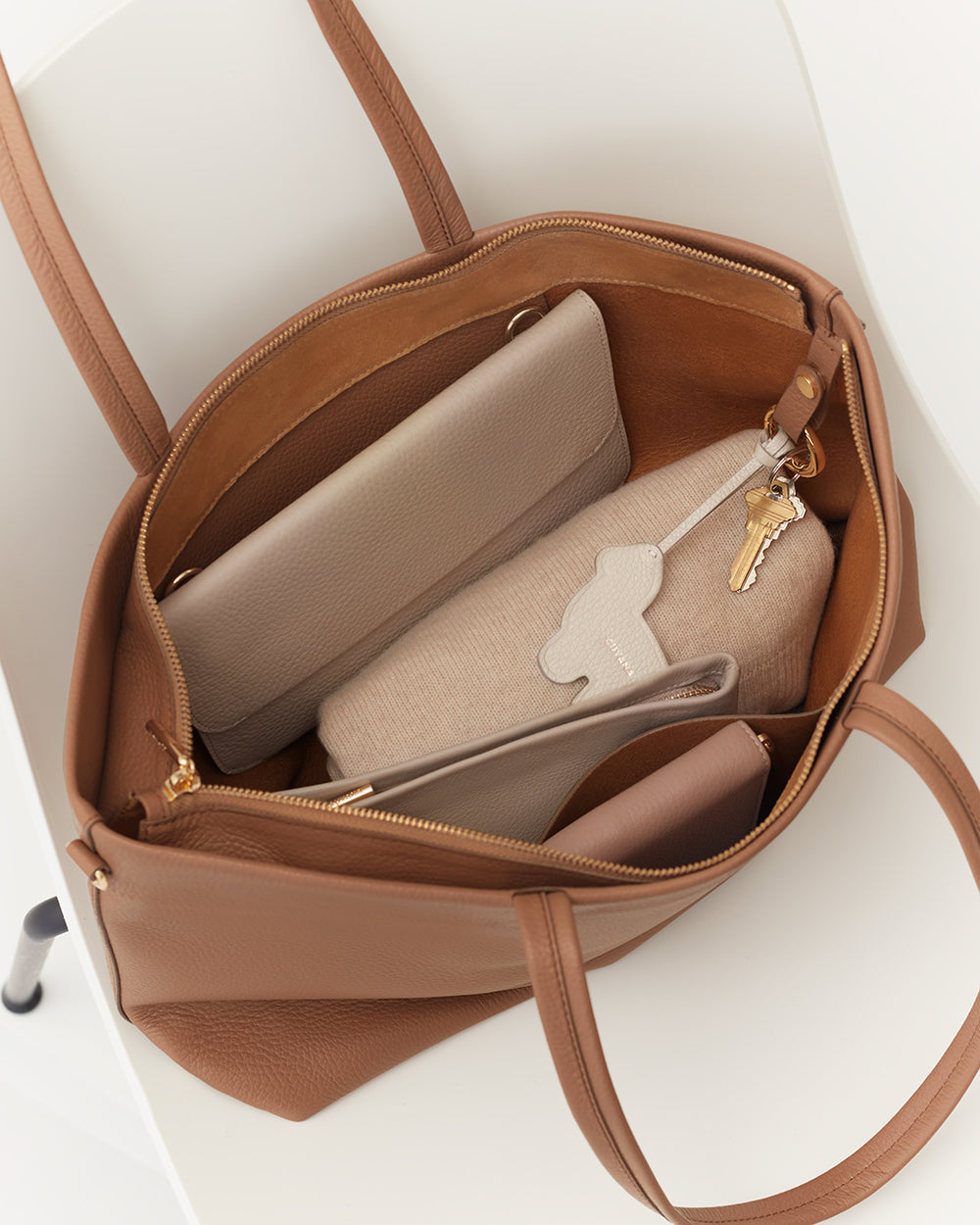 Small Easy Zipper Tote Open tote bag with a wallet, pouch, and keys inside.