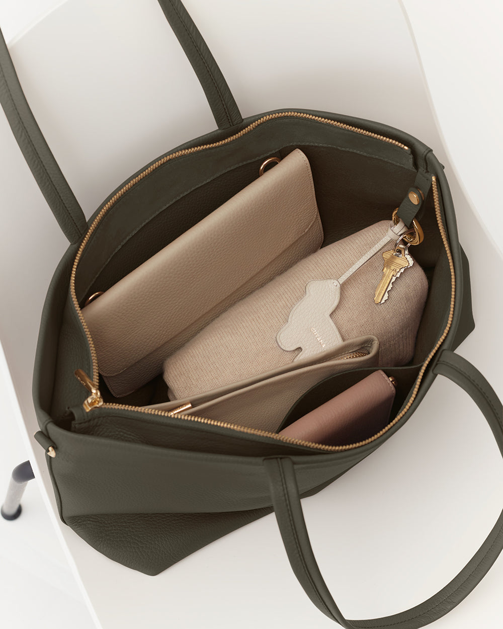 Small Easy Zipper Tote Open tote bag with a wallet, pouch, and keys inside.