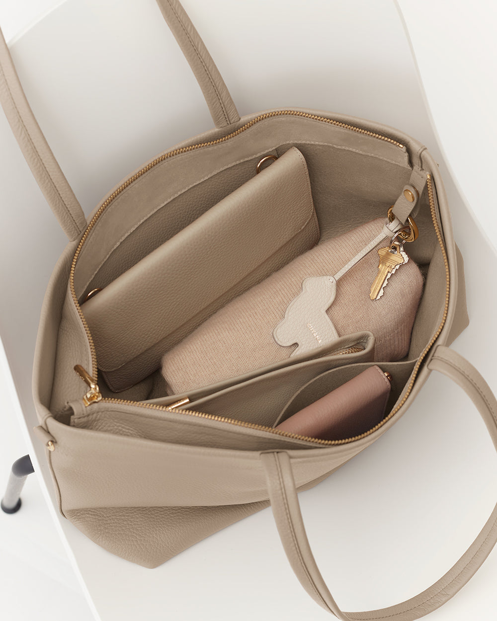 Small Easy Zipper Tote Open tote bag with a wallet, pouch, and keys inside.