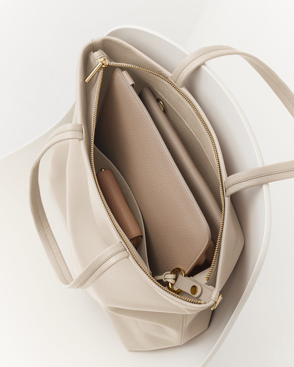 Tall Easy Zipper Tote Open totel bag with a tablet and a small pouch inside.