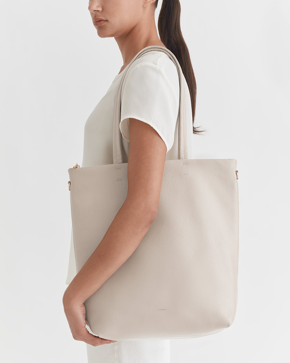 Tall Easy Zipper Tote Person holding a large tote bag over their shoulder