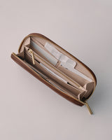 Open wallet with multiple compartments and a zipper.