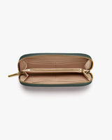 Open wallet with multiple compartments and a zipper closure.