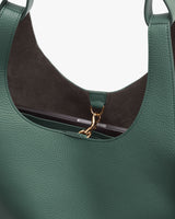 Open handbag with a visible clasp inside.
