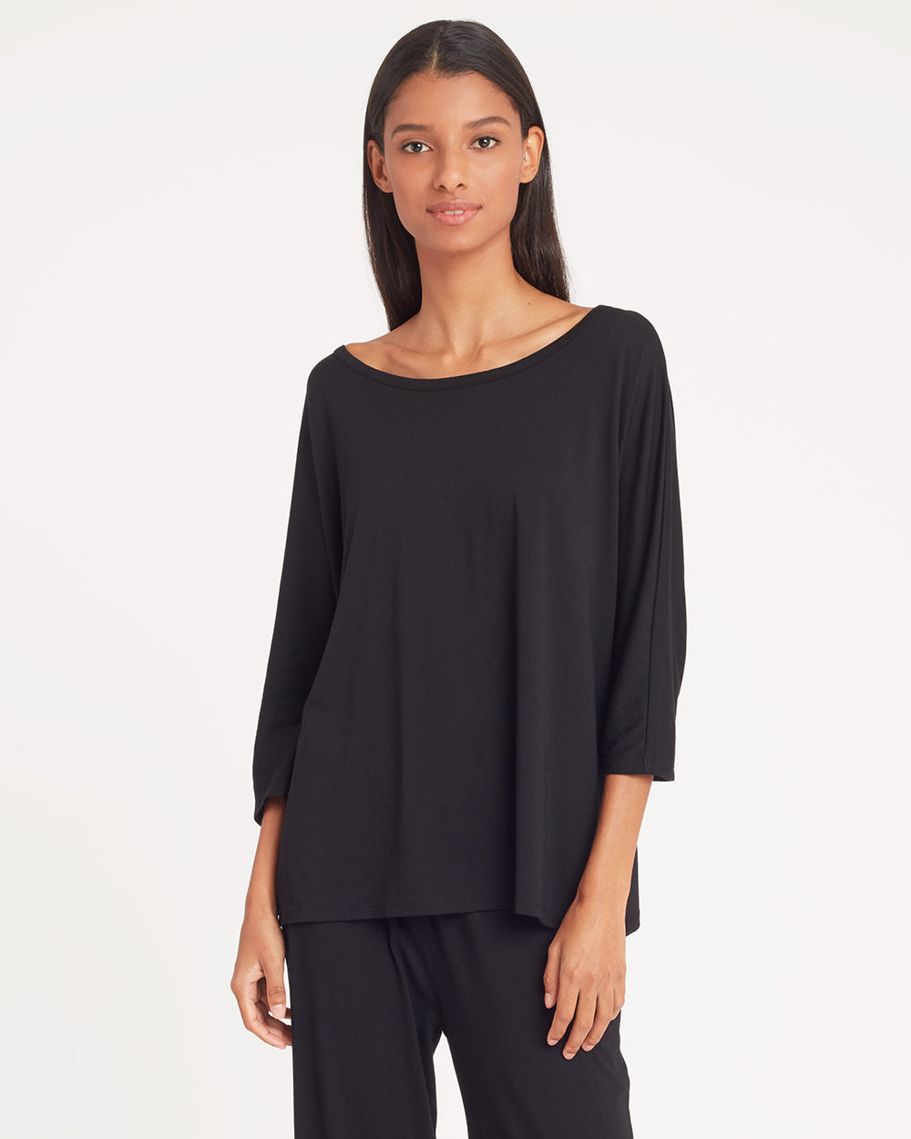 Organic Pima Drape-Back Top Woman standing and looking at the camera, wearing a casual outfit.
