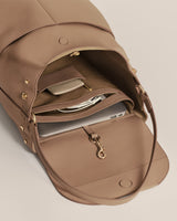 Open backpack with laptop and items inside