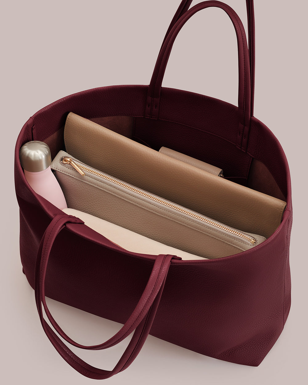 Classic Easy Tote Open tote bag with a bottle, laptop sleeve, and pouch inside.