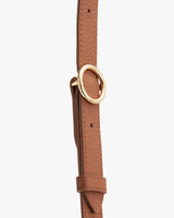 Leather strap with a circular metal buckle.