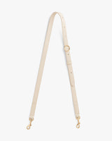 Adjustable strap with metal clasps and a loop.