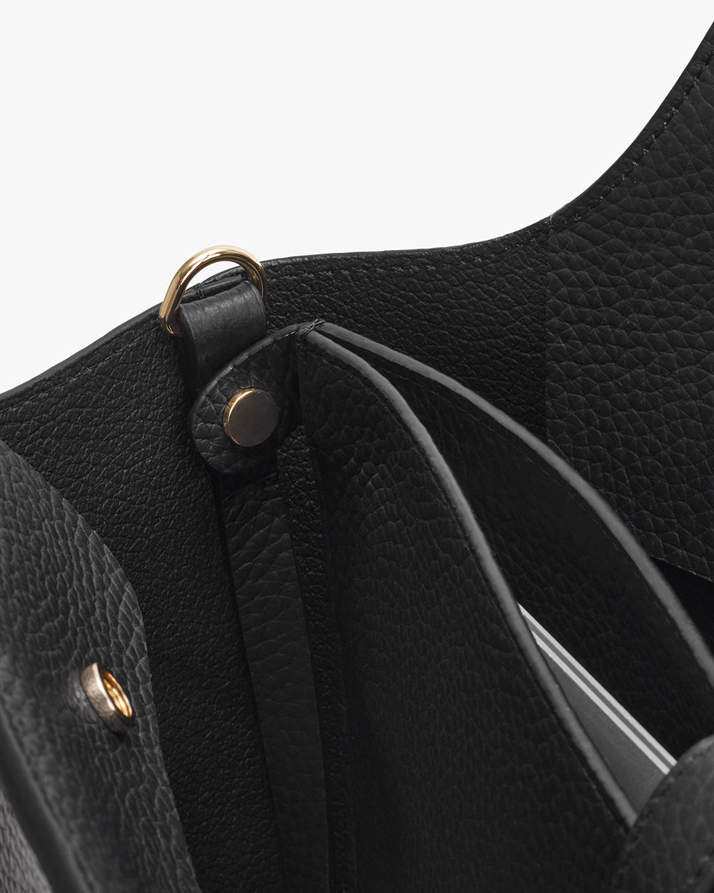 Close-up view of an open handbag with visible inner compartments.