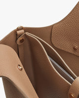 Close-up of an open handbag showing the interior details.