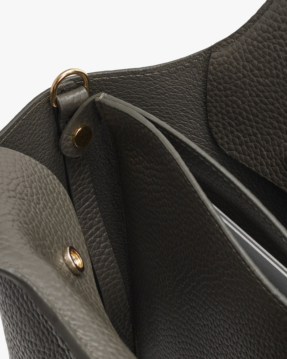 Close-up view of a handbag showing the clasp and stitching detail.