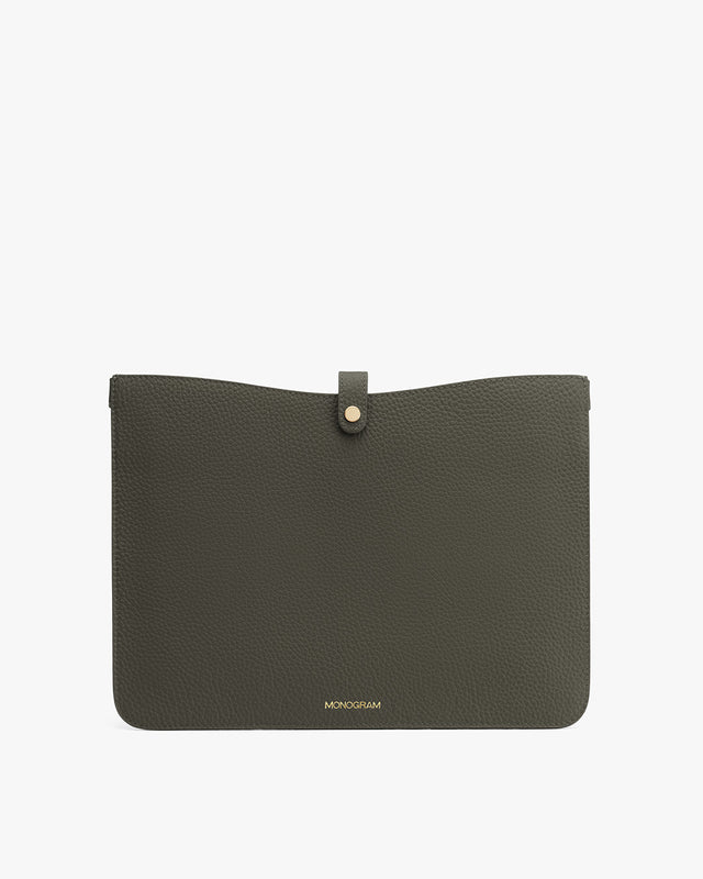 Leather clutch with a front flap and button closure, branded at the bottom.