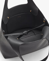 Open handbag with visible interior and top handles.