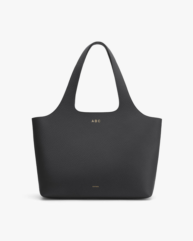 Tote bag with handles and personalized initials_ABC on front.