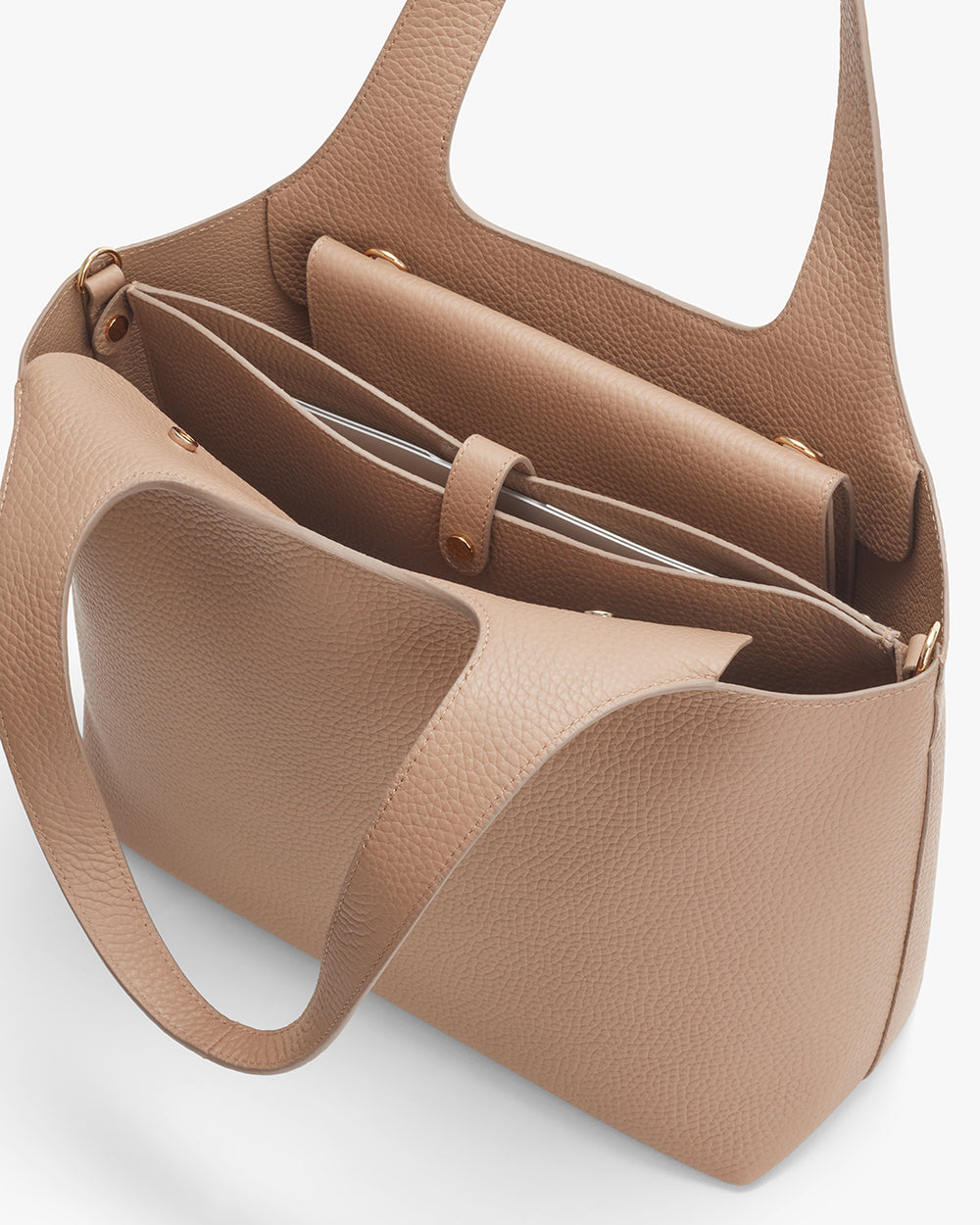 Open handbag showing interior and handles.