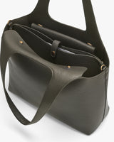 Open handbag with two handles and a shoulder strap.