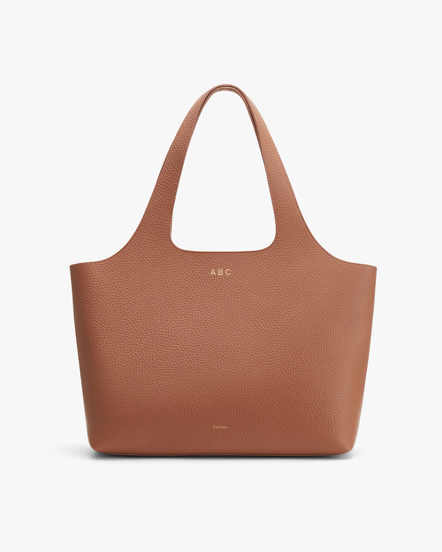 Tote bag with initials 'ABC' on the front.