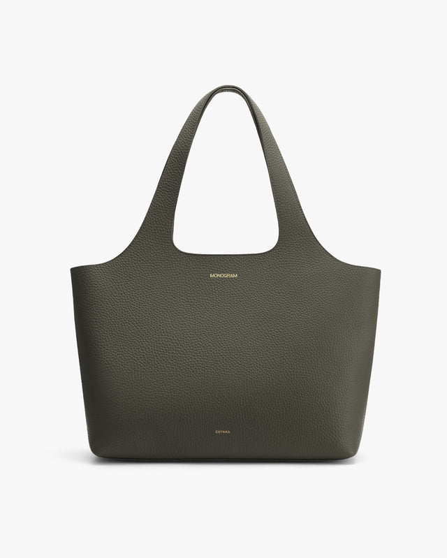 Large tote bag with a textured surface and brand logo at the center front.