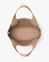 Open handbag viewed from above showing interior structure and straps.