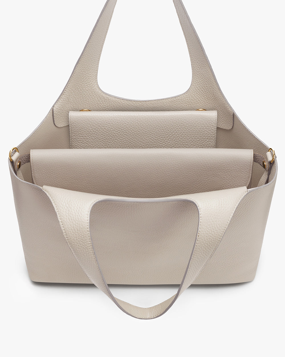 Handbag with top handle and front pocket, includes a smaller pouch inside.