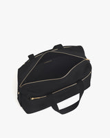 Open travel bag with shoulder strap and zippered compartments