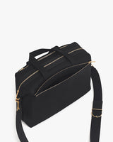 Travel bag with shoulder strap and zippered compartments