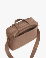Shoulder bag with zip pocket and adjustable strap.
