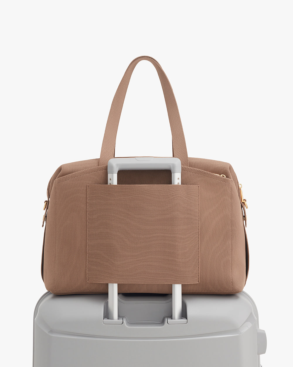 Overnight Bag (Recycled Knit) Travel bag on suitcase handle with side pocket facing front