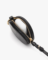 Small oval bag with zipper and attached strap.