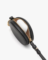 Small oval-shaped purse with a zipper and attached strap.