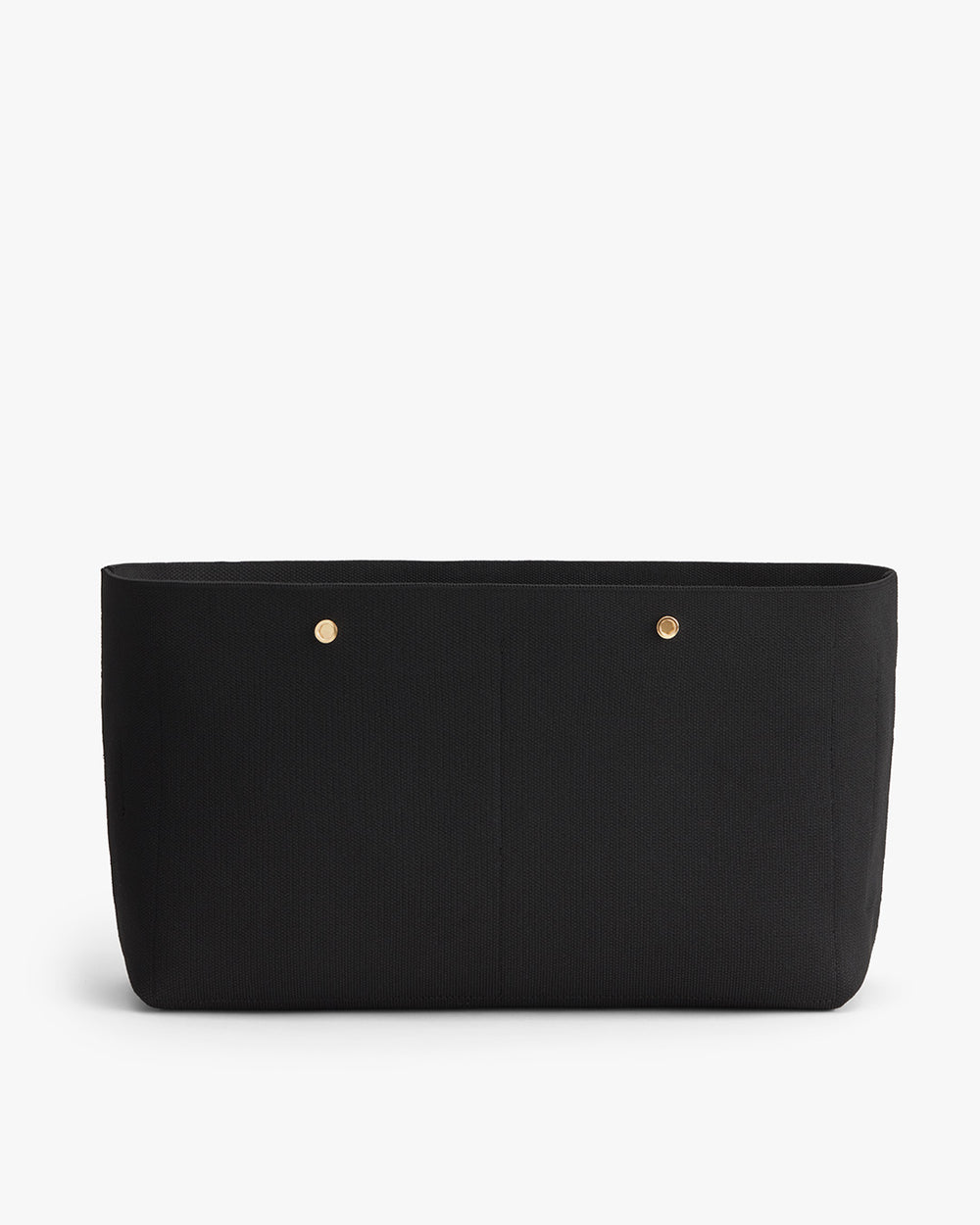 Black handbag with two front pockets and gold-tone rivets.