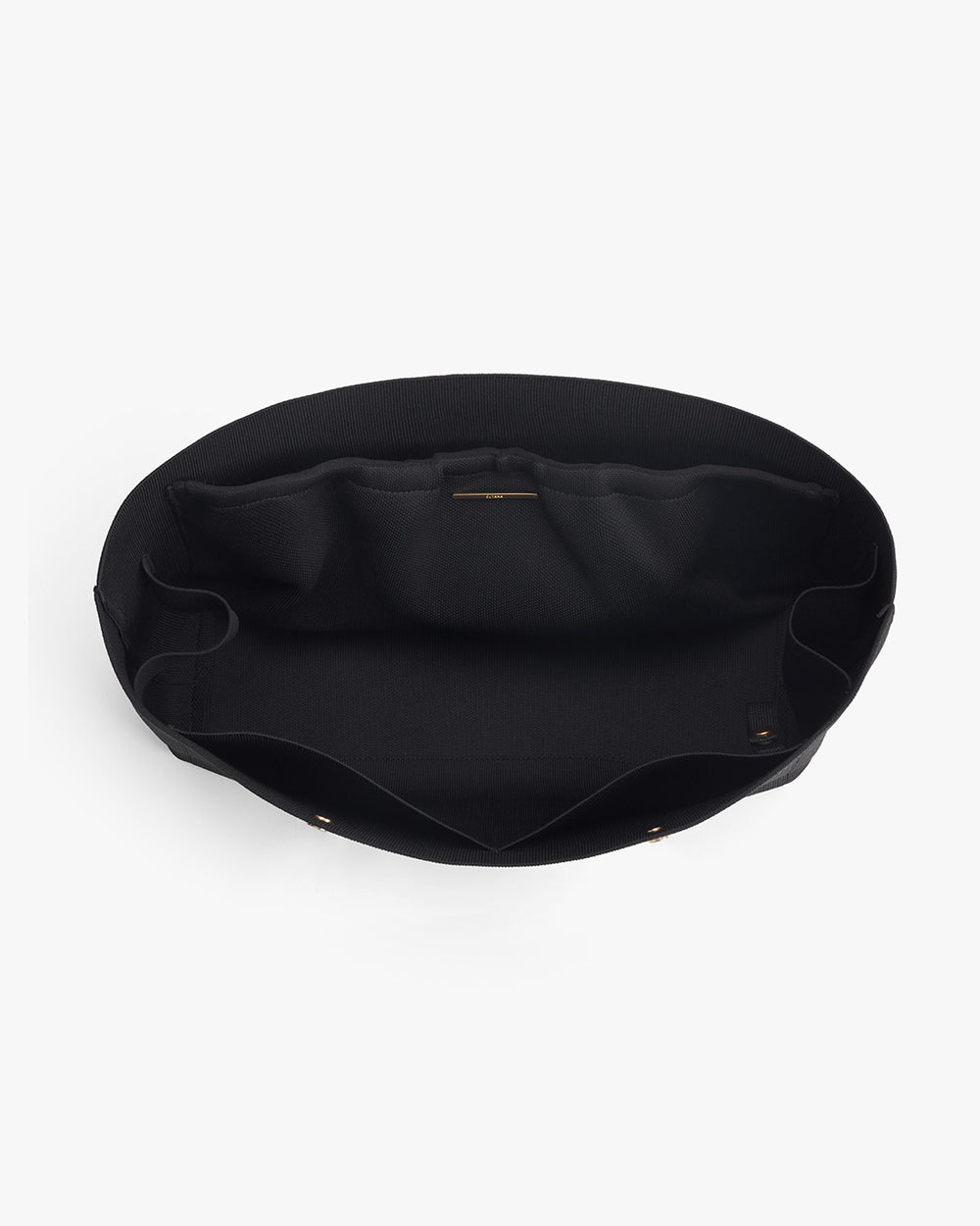 Open fabric handbag viewed from above showing the interior.