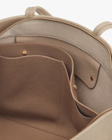 Close-up view of an open backpack with an inner pocket.