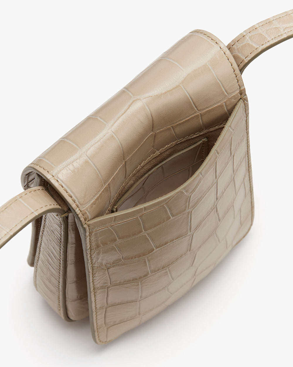 Open handbag with a textured design and a shoulder strap.